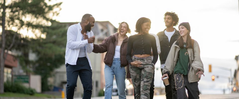 Teens walking through neighborhood and laughing