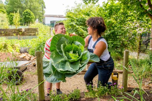 Thumbnail for Teen volunteering at a local garden