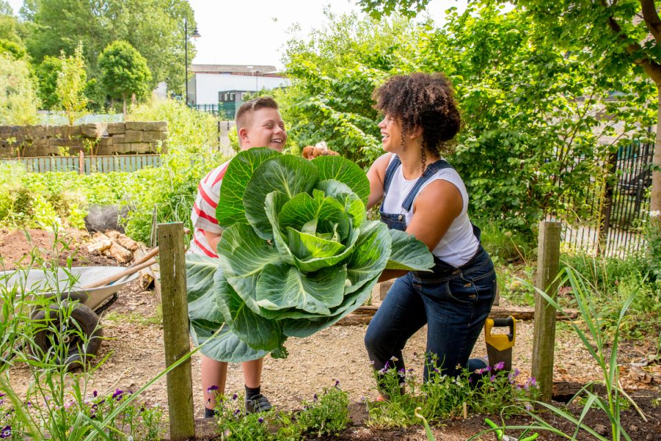 Teen volunteering at a local garden